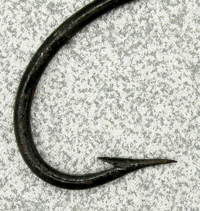 Unknown blind eye Salmon hooks. Shows three close up shots of three of the points/barbs. These were salvaged from vintage flies. Gift from Bruno Pimpanini.