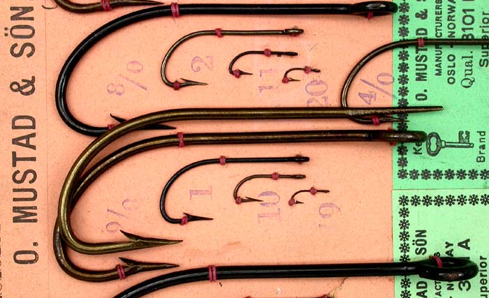 I took the second largest hook in the first group, a 9/0 and placed it alongside a 9/0 #3101 A on a later Mustad sample card and except for the taper/eye and point, hollow/dublin, both hooks are near matches. This does not necessarily cast a shadow on the age of Bjørnar’s hook because the Limerick is a very old bend. Just an interesting exercise.  All of these hooks are very well done.  If anyone has more information on these hooks, Bjørnar would like to hear them. You can contact him via email at flyfish@online.no