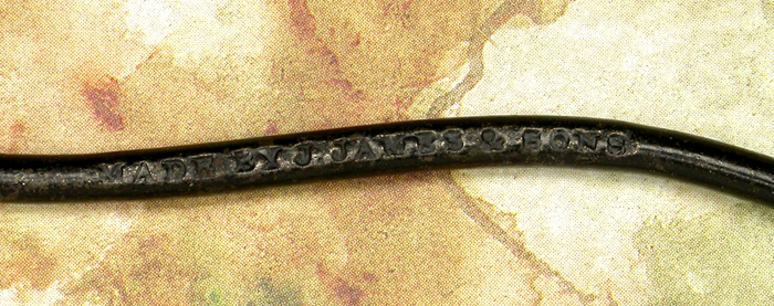 36b  John James & Sons. This hook is embossed with “Made by J. James & Sons on one side and Victoria Works, Redditch on the other. It is bout 3 7/8” long and has a gape of about 1 ¼” directly above the point. It is in remarkable shape with much of the original japan still in tact.