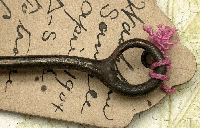 32b Washburn, sample hook, 13/0, hand formed tapered, welded ring eye, bronzed, ca 1904. The eye on this hook is very big, you could put a ¼” rope through it. The hand filing is great. You can imagine the hook maker filing the wire to a very fine taper and then bending it, what looks to me to be freehand. I have three of these hooks that are all slightly different. The original tag reads, Washburn, Sample, April 1904, a triangle-S &, to trade, C or G ss and the cents symbol. Were these prototype hooks? I don’t recognize the name. There’s a story there that we are unlikely to know. 1900’s collection.