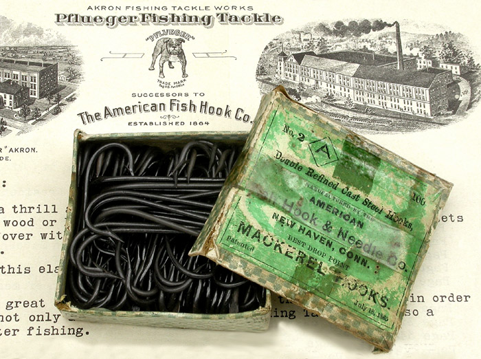 9c American Fish Hook & Needle Co., #2, Mackerel hooks, drop point, japanned. About 2 1/16” long. On the bottom of the box is another label by H.H. Crie & Co., dealers in iron & steel, Blacksmith’s stock & tools. Quarry outfits, blasting powder, fuses, &c. Carriage stock, trimmings and paints. Ship chandlery and fishermen’s goods. Guns, revolvers, powder, shot &c. Rockland, Me.